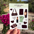 Stickervel in A6 formaat met stickers van een tasje, journal, horloge, lipstick, ballerina's, hartjes en meer